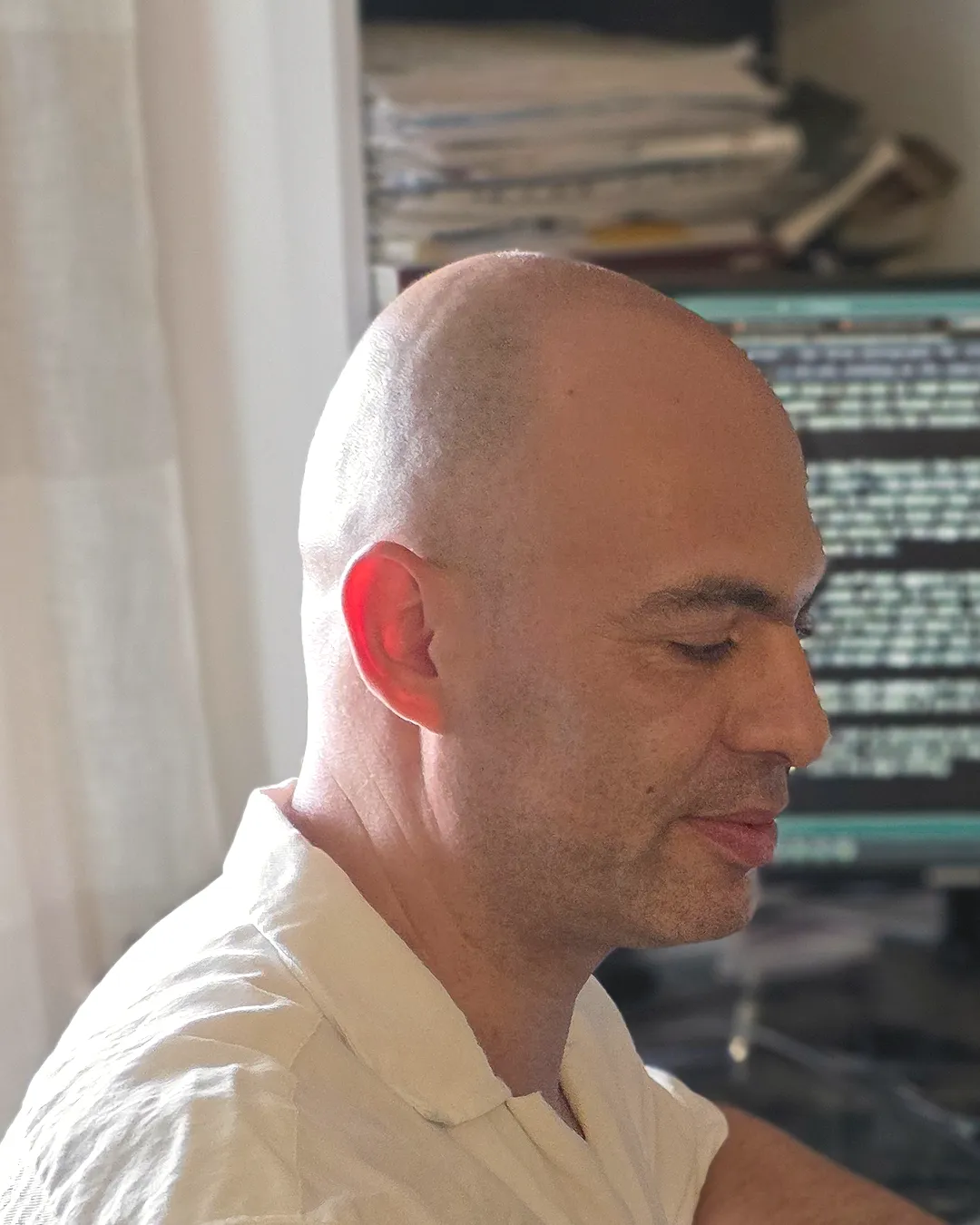 Vitaly Gurvich at his desk, looking at the screen